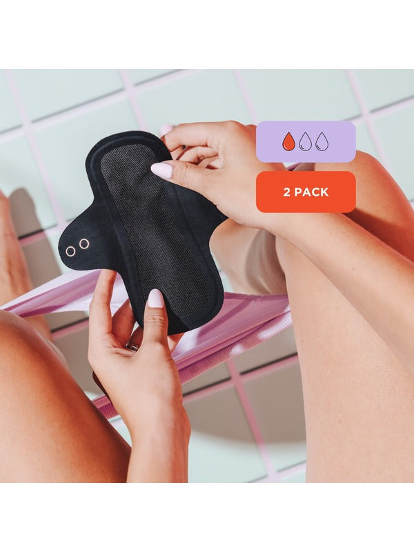 Hello Period reusable liner held in hand with absorbency details