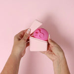 Hello Caddy with menstrual disc held in both hands