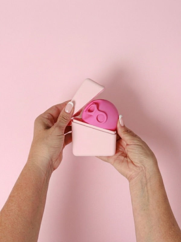 Hello Caddy with menstrual disc held in both hands