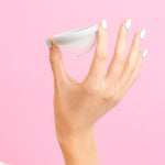 Hello Period Sea Fog menstrual disc held in hand