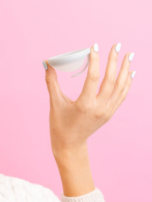 Hello Period Sea Fog menstrual disc held in hand