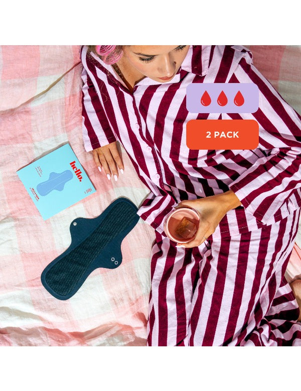 Hello Period Overnight Success pad in a relaxed bedtime setting