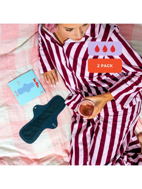 Hello Period Overnight Success pad in a relaxed bedtime setting