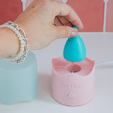 Hello Period menstrual cup being placed in the Steamy steriliser