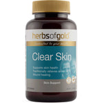 Brown Herbs of Gold Clear Skin bottle with a gold screw cap, a white-and-gold brand header and a turquoise label above a grey Skin Support band.