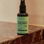 Black Chicken Hypochlorous Acid Spray – Skin Rescue Mist bottle on a marble bathroom counter – Black Chicken Remedies Hypochlorous Acid Spray Skin Rescue Mist 50ml