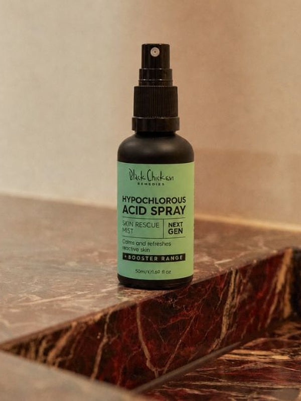 Black Chicken Hypochlorous Acid Spray – Skin Rescue Mist bottle on a marble bathroom counter – Black Chicken Remedies Hypochlorous Acid Spray Skin Rescue Mist 50ml