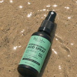 Black Chicken Hypochlorous Acid Spray – Skin Rescue Mist bottle on sand – Black Chicken Remedies Hypochlorous Acid Spray Skin Rescue Mist 50ml