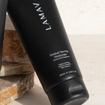 LAMAV Gradual Tanning Moisturiser tube on a neutral background
