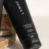 LAMAV Gradual Tanning Moisturiser tube on a neutral background