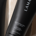 LAMAV Self Tanning Lotion tube on a neutral background