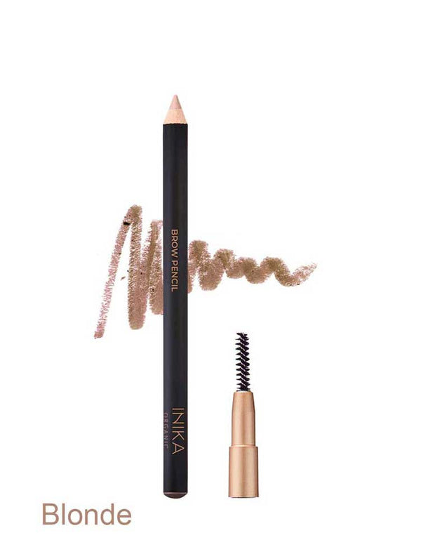 Black INIKA brow pencil in Blonde standing beside a small spoolie brush in a gold cap, with a light brown scribbled swatch behind the pencil and the shade name Blonde printed below.