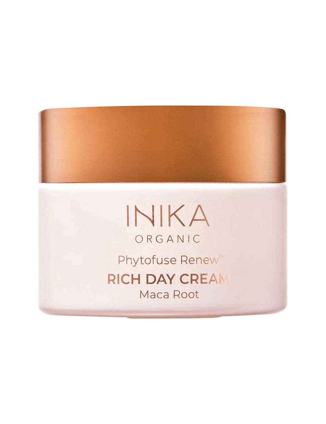 Round pale pink INIKA Phytofuse Renew Rich Day Cream jar with a broad gold lid and gold lettering naming Maca Root, against a white background.