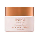 Round pale pink INIKA Phytofuse Renew Rich Night Cream jar with a broad gold lid and gold lettering naming Resveratrol, against a white background.