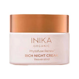 Round pale pink INIKA Phytofuse Renew Rich Night Cream jar with a broad gold lid and gold lettering naming Resveratrol, against a white background.
