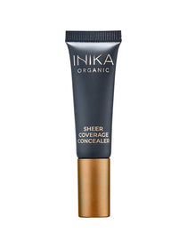 A 10ml tube of INIKA Organic Sheer Coverage Concealer, featuring a black body, gold cap, and white text on the front, is shown against a white background.