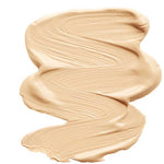 INIKA Organic Sheer Coverage Concealer 10ml shown in a beige "Sand" swatch with a smooth, creamy texture on a white background. This vegan formula offers a natural finish ideal for all-day wear.
