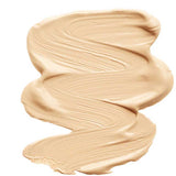INIKA Organic Sheer Coverage Concealer 10ml shown in a beige "Sand" swatch with a smooth, creamy texture on a white background. This vegan formula offers a natural finish ideal for all-day wear.