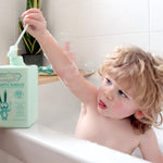 Child playing with Jack N' Jill Blissful Bubbles in the bath