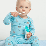 Young child using Jack N' Jill blueberry toothpaste
