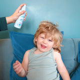 Jack N' Jill detangler being sprayed onto a child's hair
