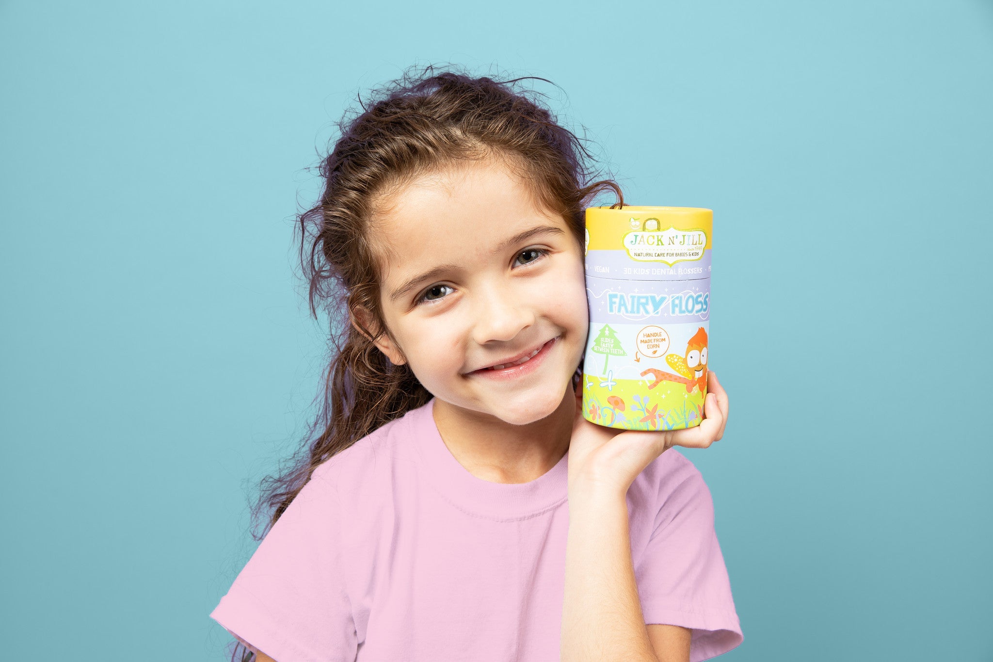 Child holding Jack N' Jill Fairy Floss picks