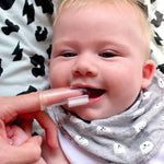 Baby using the Jack N' Jill Stage 1 silicone finger brush