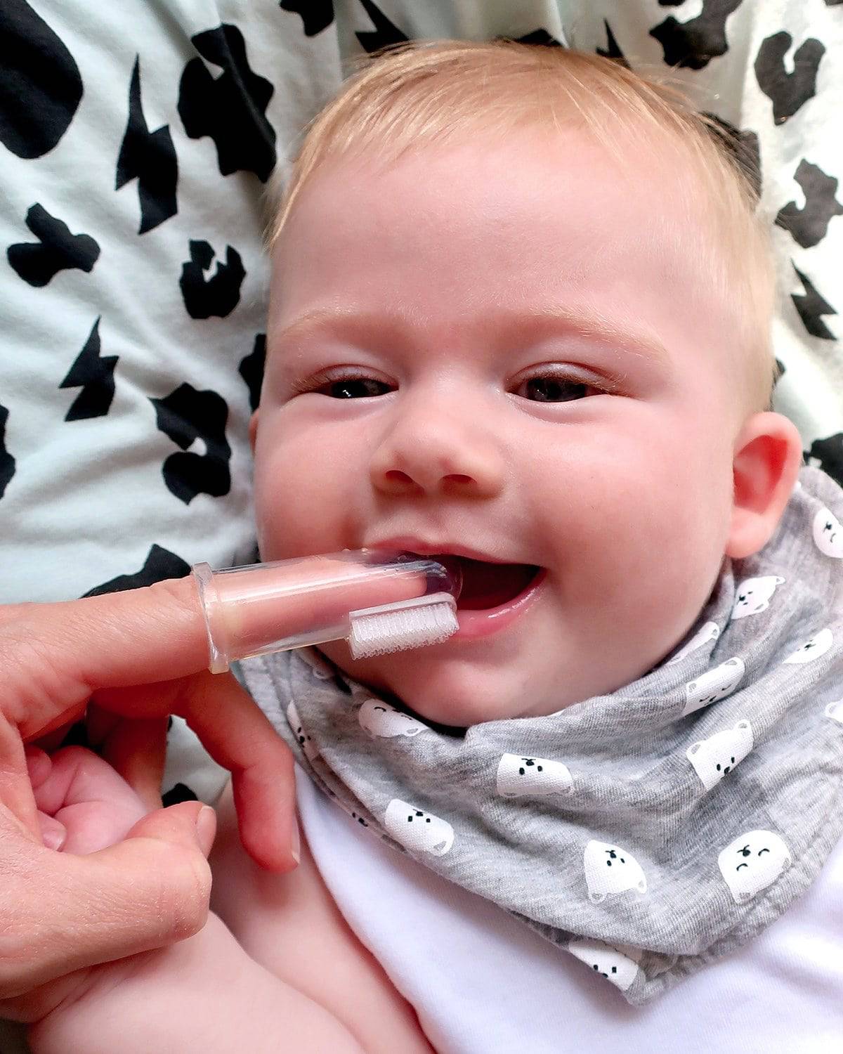 Baby using the Jack N' Jill Stage 1 silicone finger brush