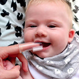 Baby using the Jack N' Jill Stage 1 silicone finger brush
