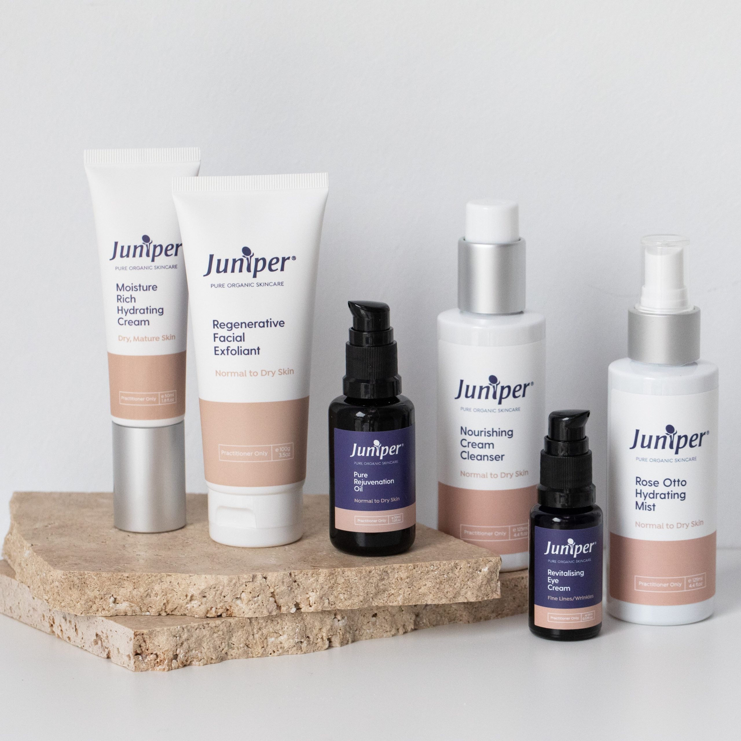 Juniper Revitalising Eye Cream in the mature skincare range styled on natural stone