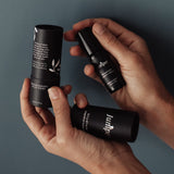 Juniper Studium aromatherapy pulse point held in hands