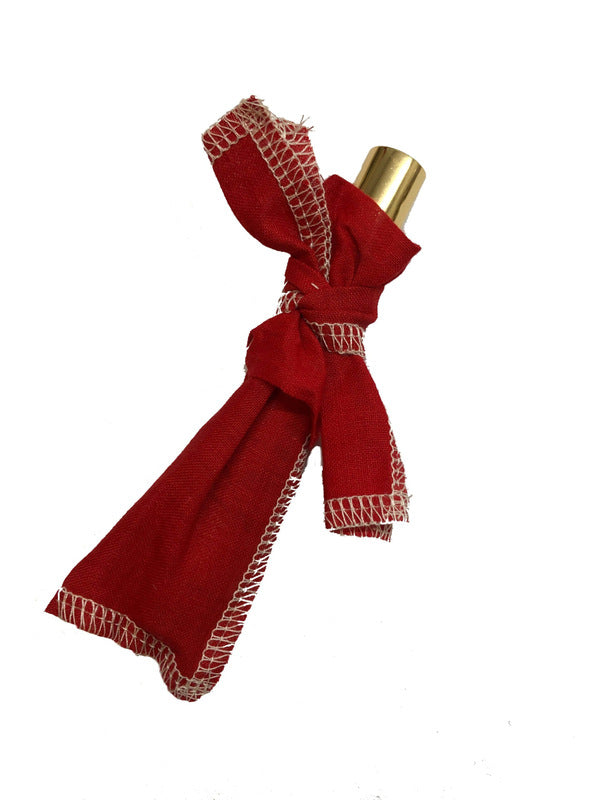Fresca Kimono Natural Parfum wrapped in red fabric