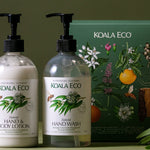 Koala Eco Eucalyptus and Rosemary Hand Care Gift Pack styled with greenery against a deep green background
