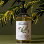 Koala Eco Lemon and Tea Tree Hand Sanitiser styled with golden wattle branches