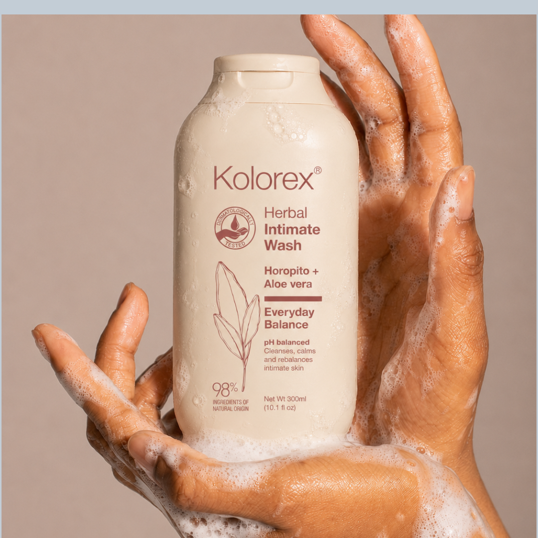 Hands holding Kolorex Herbal Intimate Wash Everyday Balance with cleansing foam