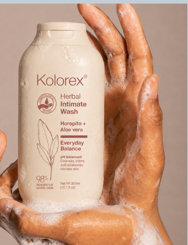 Hands holding Kolorex Herbal Intimate Wash Everyday Balance with cleansing foam