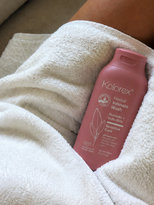 Kolorex Herbal Intimate Wash Sensitive Care styled with a towel