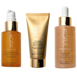 KORA Organics Best Sellers Trio: Turmeric Glow Foaming Cleanser, Brightening and Exfoliating Scrub and Mask, and Noni Glow Face Oil.