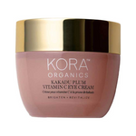 Rounded dusty-pink jar of KORA Organics Kakadu Plum Vitamin C Eye Cream with white lettering and a wide reflective gold lid.