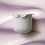 KORA Organics Plant Stem Cell Retinol Alternative Moisturiser refill pod set against a soft lilac cream texture.