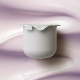 KORA Organics Plant Stem Cell Retinol Alternative Moisturiser refill pod set against a soft lilac cream texture.