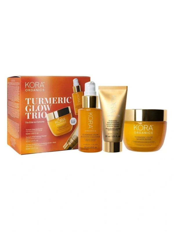 KORA Organics Turmeric Glow Trio: Gift box with the cleanser, scrub and mask, and moisturiser displayed alongside.