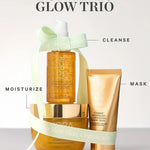 KORA Organics Turmeric Glow Trio: The three skincare products arranged with a pale green ribbon and cleanse, mask and moisturise labels.