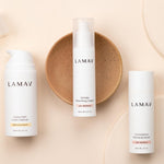 LAMAV Age-Defence Skin Discovery trio on peach, with Hydra-Calm Cream Cleanser, Wrinkle Smoothing Cream and Commiphora Plumping Serum.