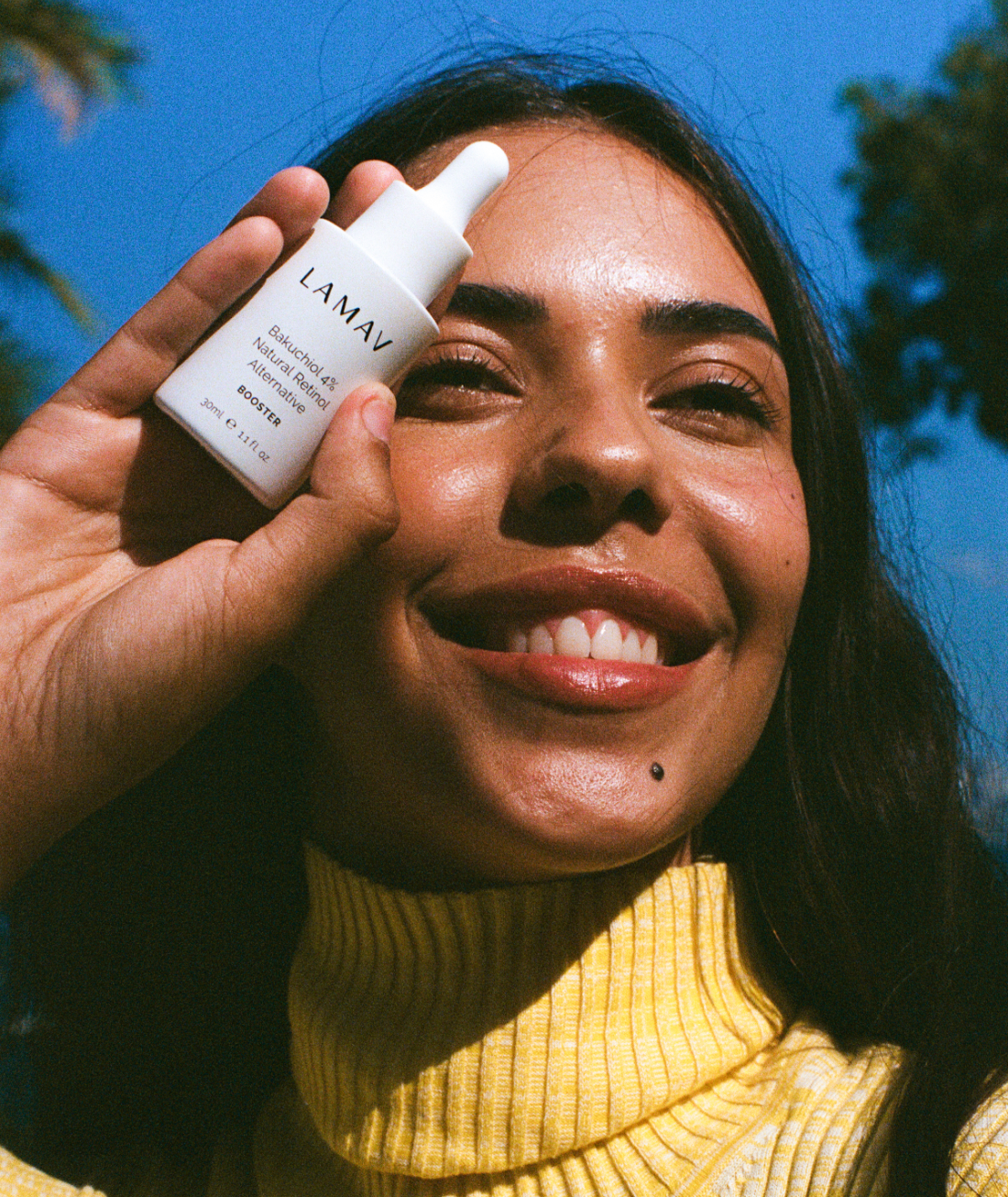 Woman holding LAMAV Bakuchiol 4% Natural Retinol Alternative