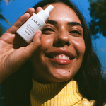 Woman holding LAMAV Bakuchiol 4% Natural Retinol Alternative