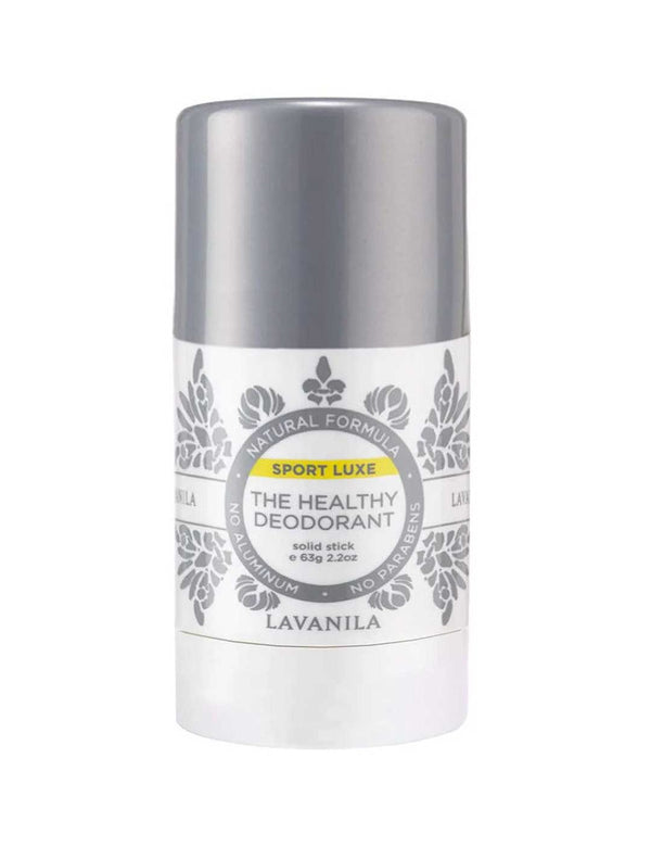 White Lavanila Sport Luxe deodorant stick with a metallic silver cap, grey botanical patterns and a circular label with a yellow Sport Luxe stripe.