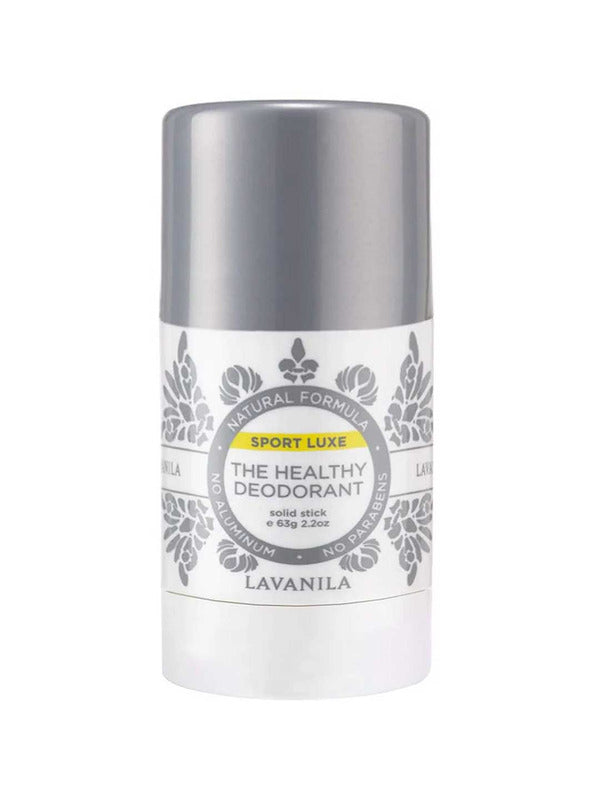 White Lavanila Sport Luxe deodorant stick with a metallic silver cap, grey botanical patterns and a circular label with a yellow Sport Luxe stripe.