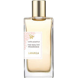 A clear glass bottle of Lavanila The Healthy Fragrance EDT Vanilla Grapefruit 50ml features a gold cap, light amber liquid, and a label with a pale pink floral accent, highlighting its natural scent.