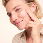 Woman applying Lavera Basis Sensitive Calming Night Cream